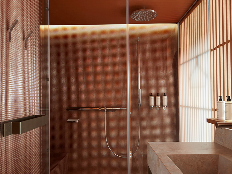 Spacious walk-in rain shower with marble sink and flooring