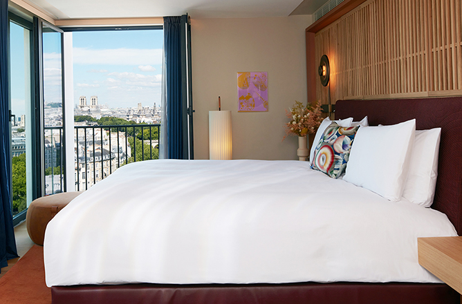 http://Hotel%20studio%20with%20king%20bed%20and%20open%20balcony%20overlooking%20Paris