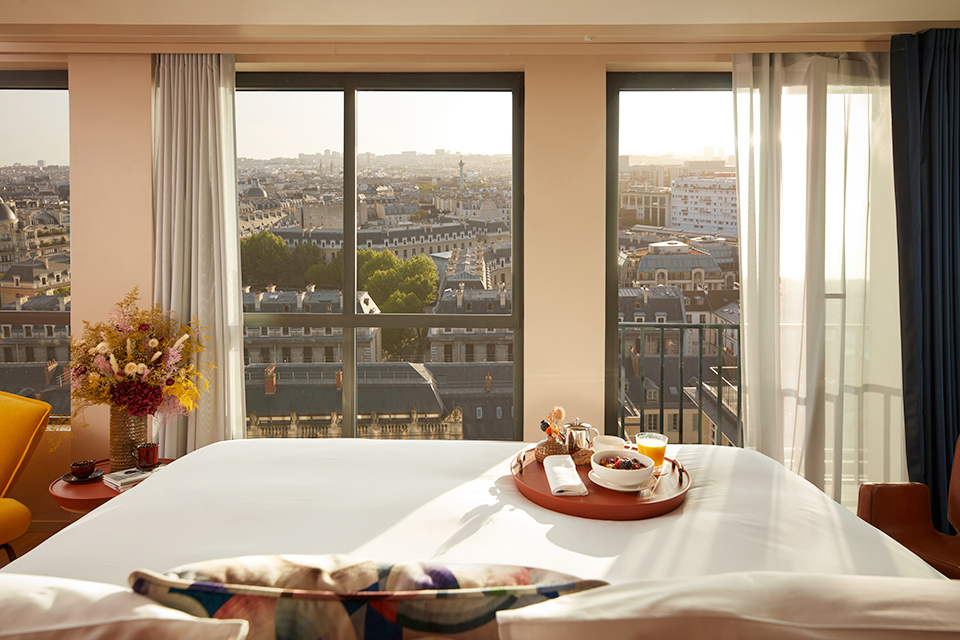 http://Breakfast%20on%20the%20bed%20with%20Paris%20stretched%20out%20through%20the%20wide%20windows.