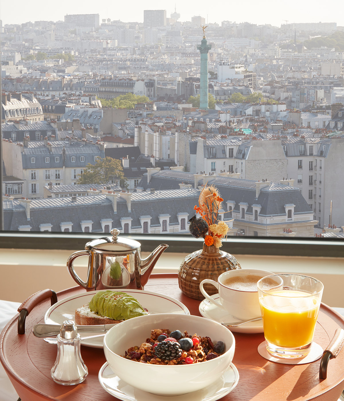 Breakfast tray on the balcony with a view over Paris.