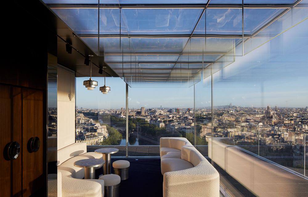 http://The%20far%20end%20of%20a%20seating%20area%20with%20full-length%20windows%20giving%20with%20a%20beautiful%20view%20of%20Paris
