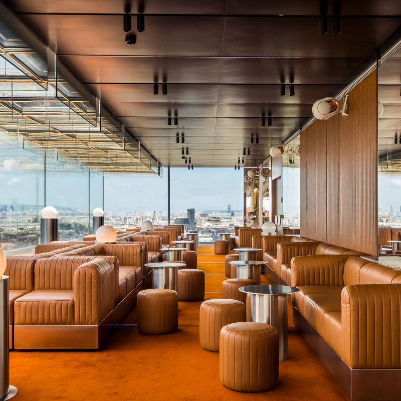 Leather seating and full length windows characterise the club