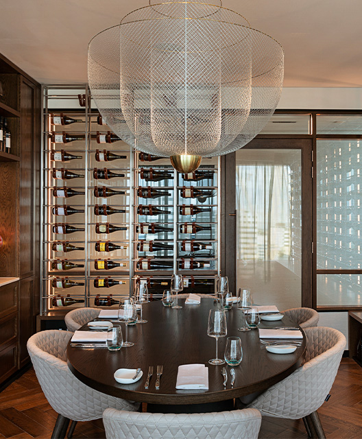 http://A%20small%20wine%20cellar%20with%20a%20oval%20table%20in%20the%20centre%20and%20a%20beautiful%20large%20ceiling%20light%20hanging%20from%20the%20ceiling