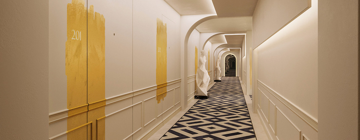 A long white hallway with patterned flooring and statues lining the hallway