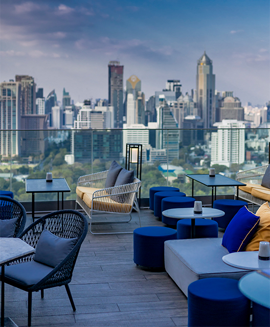 http://A%20terrace%20with%20a%20stunning%20view%20of%20Bangkok.%20Blue%20funiture%20fill%20the%20terrace.