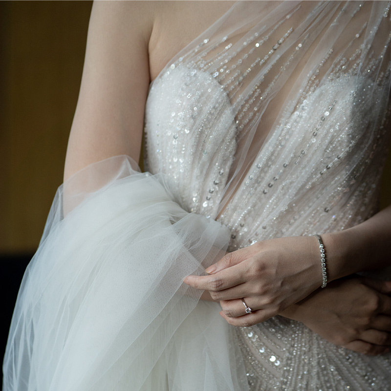 A woman wearing a beautiful white wedding dress
