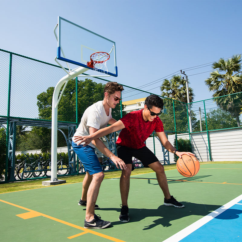 Two men playing Basketball