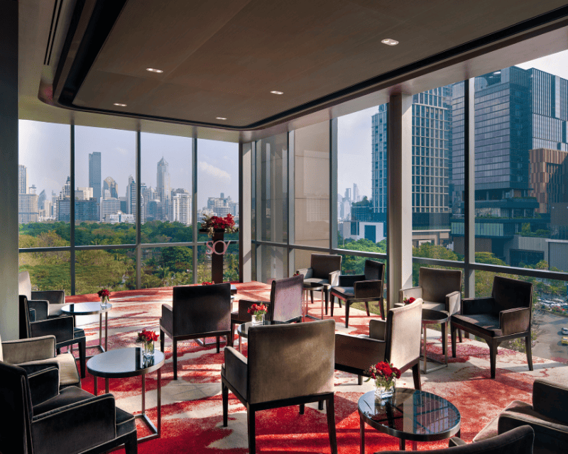 http://Stylish%20meeting%20lounge%20at%20SO/%20Bangkok%20with%20floor-to-ceiling%20windows%20overlooking%20Lumphini%20Park%20and%20Bangkok%20skyline
