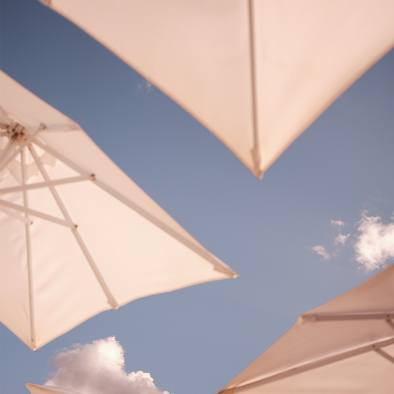 White parasols and blue sky. 