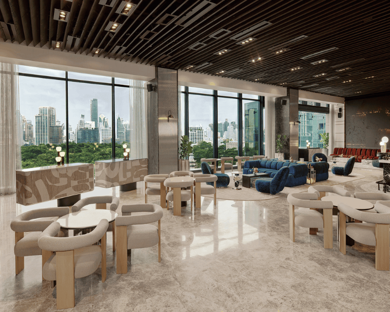 http://Stylish%20lounge%20at%20FLOOR/9,%20SO/%20Bangkok,%20featuring%20contemporary%20seating,%20marble%20flooring,%20and%20floor-to-ceiling%20windows%20overlooking%20Lumphini%20Park%20and%20the%20Bangkok%20skyline.