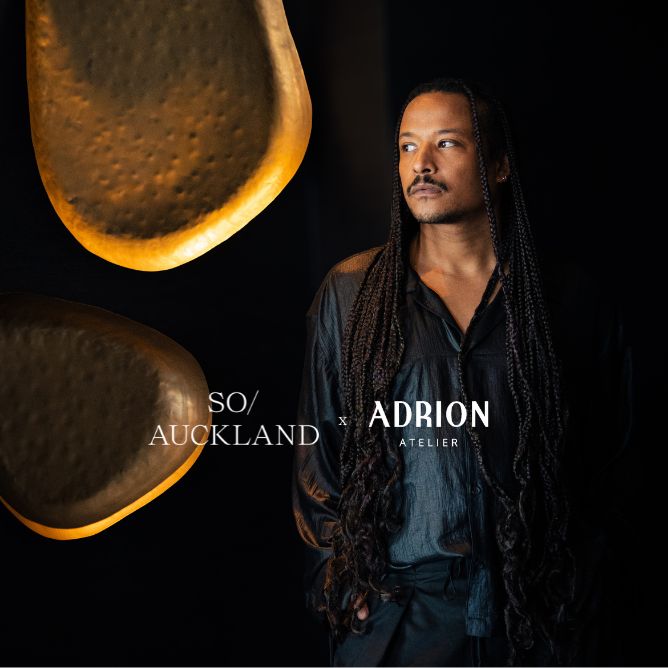An artistic image featuring a close-up of a textured, golden object alongside a person in a dark outfit, showcasing a unique collaboration.