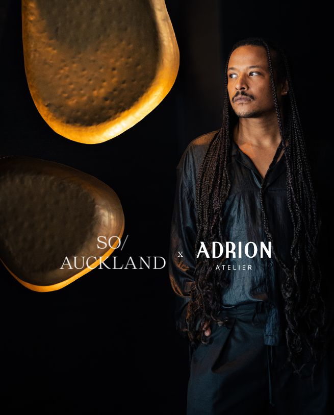 An artistic image featuring a close-up of a textured, golden object alongside a person in a dark outfit, showcasing a unique collaboration.