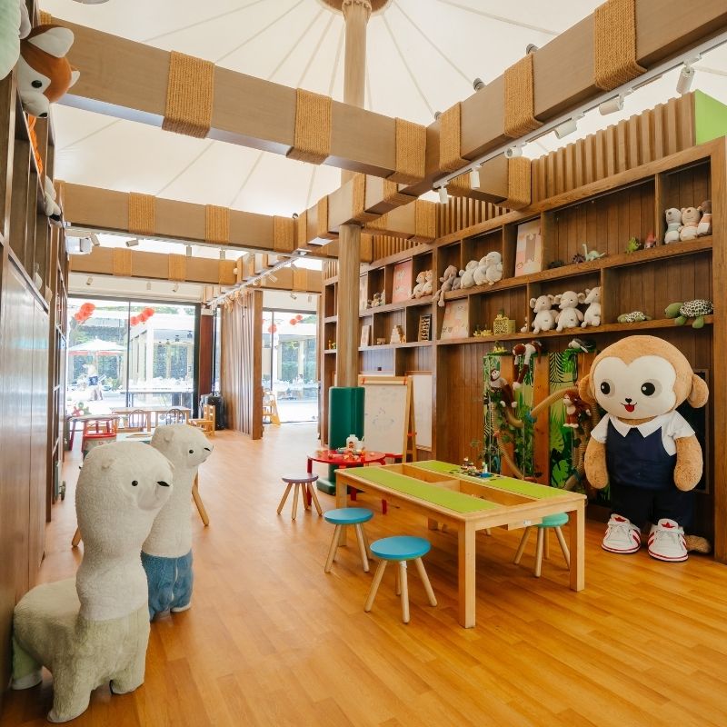 Family-friendly Kids Tent indoor play area with plush animal toys and wooden activity stations at SO/ Sofitel Hua Hin