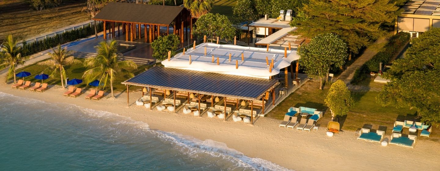 Aerial view of the beachfront restaurant and outdoor lounge area on the sand at SO/ Sofitel Hua Hin