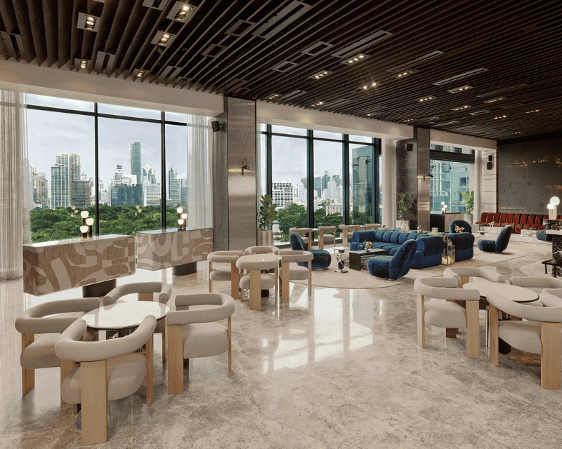 http://Stylish%20lounge%20at%20FLOOR/9,%20SO/%20Bangkok,%20featuring%20contemporary%20seating,%20marble%20flooring,%20and%20floor-to-ceiling%20windows%20overlooking%20Lumphini%20Park%20and%20the%20Bangkok%20skyline.